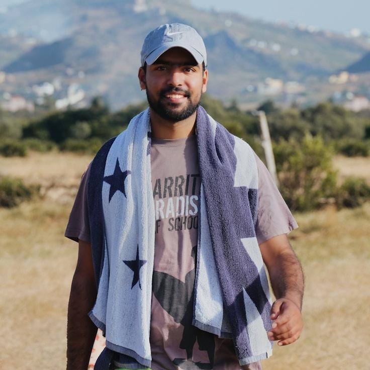 Kaveri Mehta, Lead Design Curator at Wind Grove Forge, reviewing corporate floral arrangements